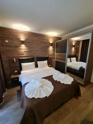 a bedroom with a large bed with two pillows at MitProt Panorama Bay 2 luks Apartment ap100 in Sveti Vlas