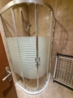 a shower with a glass enclosure in a bathroom at MitProt Panorama Bay 2 luks Apartment ap100 in Sveti Vlas
