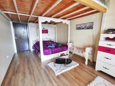 a bedroom with a purple bed and a mirror at Villa Victoria - a luxury appartment with icredible Seaview in Sozopol