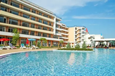 a large swimming pool in front of a building at Grand Kameliq in Sunny Beach
