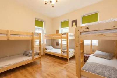 a room with four bunk beds in it at Nomado Hostel in Varna City