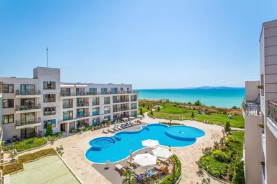 an aerial view of a resort with a swimming pool at DIAMOND APARTMENT №1 - RELAX HOLIDAY VIEWS SEA AND POOL in Burgas City