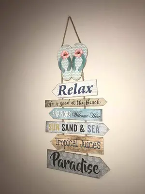 a wooden sign with a bird on it at DIAMOND APARTMENT №1 - RELAX HOLIDAY VIEWS SEA AND POOL in Burgas City