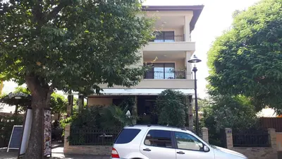 a white van parked in front of a building at Gradina in Chernomorets