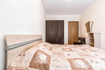 a bedroom with a large bed in a room at Kuban Resort & Aquapark - All Inclusive in Sunny Beach