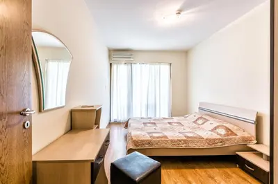 a bedroom with a bed and a mirror at Kuban Resort & Aquapark - All Inclusive in Sunny Beach
