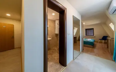 a hallway leading to a bathroom with a bedroom at Sea View Hills in Sveti Vlas