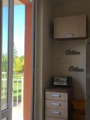 a kitchen with a toaster on a wall next to a door at Apartment in Nessebar Fort Club in Sunny Beach