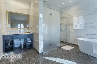 a bathroom with a tub and a sink and a shower at Villa Promenade in Burgas City