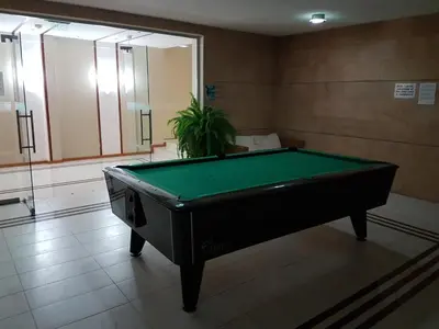 a pool table sitting in a room with ahibition at Apartment Garden of Eden in Sveti Vlas