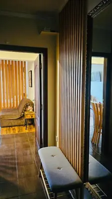 a living room with a mirror and a couch at Apartment 7 and Studio 2 Quietly and peaceful place to relax in Sozopol