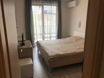 a small bedroom with a bed and a window at Star Dreams, Sveti Vlas in Sveti Vlas