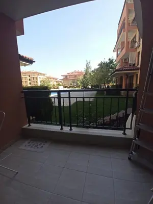 a balcony with a railing with a view of a city at Star Dreams, Sveti Vlas in Sveti Vlas