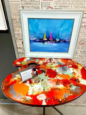 a painting on a table with a picture on it at Boutique Villa Amalia in Chernomorets