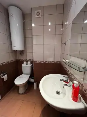a bathroom with a sink and a toilet at Mario Beach Apartment Nessebar in Nesebar