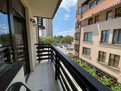 a balcony with a view of a building at Mario Beach Apartment Nessebar in Nesebar
