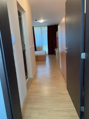 an empty hallway of a room with a bathroom at Mario Beach Apartment Nessebar in Nesebar