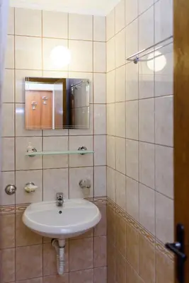 a bathroom with a sink and a mirror at Guest House Ianis Paradise in Nesebar