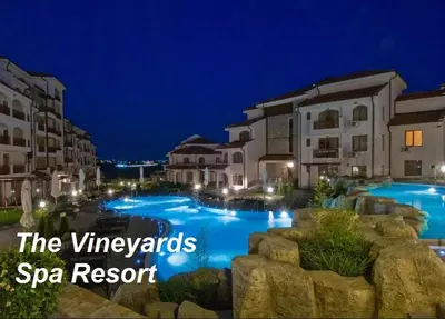 a view of a swimming pool at night at Къща за гости Мускат 2 in Aheloy