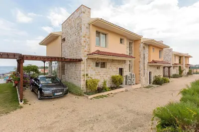 a car parked in front of a house at Coral Luxury Villas in Lozenets