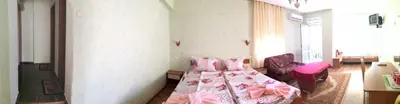 a bedroom with a bed with pink sheets and pink pillows at Anele,Kiten in Kiten