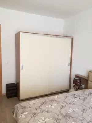 a large mirror is on the wall of a bedroom at Apartament Nora01 in Burgas City