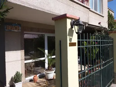 a door to a house with a fence and plants at Vila Riviera in Chernomorets