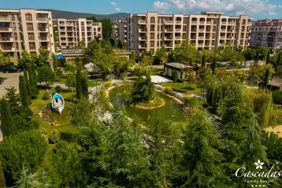 an aerial view of a park with trees and buildings at Cascadas Family Resort in Sunny Beach