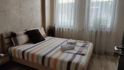 a bedroom with a bed with towels on it at Guest House Juja in Nesebar