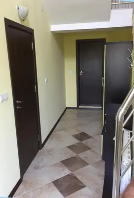 a hallway with two doors and a tiled floor at Villa Varna View in Varna City