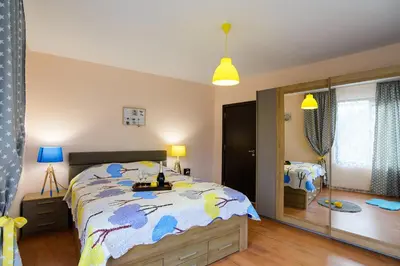 a bedroom with a bed and a large mirror at Villa Varna View in Varna City