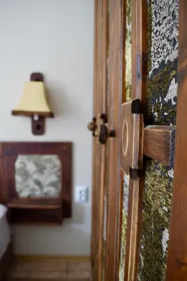 an open door to a room with a lamp at Family Hotel Apolonia in Sozopol