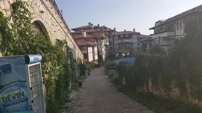 a narrow alley in a city with buildings at Jacky's Apartament - Апартамент в Свети Влас in Sveti Vlas