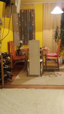 a room with two chairs and a table and a speaker at Family Hotel Denica in Obzor