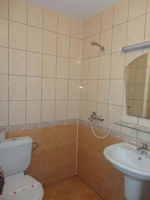 a bathroom with a toilet and a sink at Guest House Rusalka in Sozopol