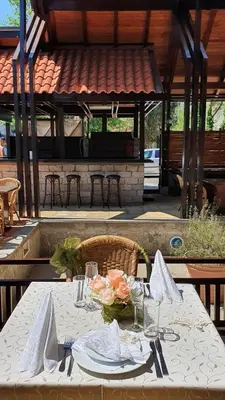 a table with a white table cloth on a patio at Hotel Villa Bora in Sunny Beach
