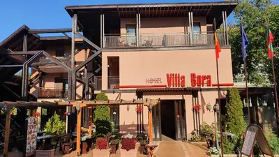 a building with a sign that reads winelor at Hotel Villa Bora in Sunny Beach