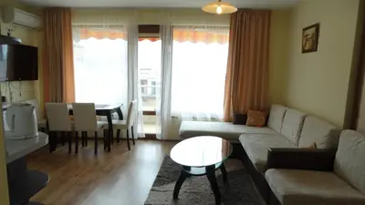 a living room with a couch and a table at Sunny Sands Studios in Burgas City
