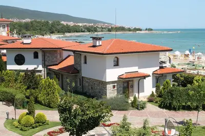 a large white house with an orange roof at Helena VIP Villas and Suites - Half Board in Sunny Beach