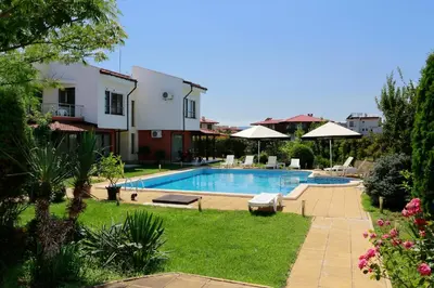a swimming pool in the yard of a house at Saint Stefan Villas in Sozopol