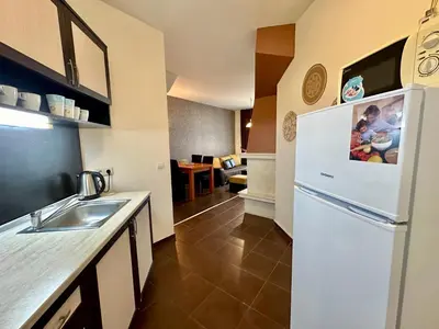 a kitchen with a sink and a refrigerator at Menada Imperial Heights Villas in Sunny Beach