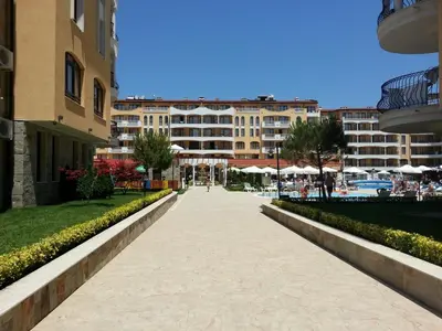 a sidewalk in a city with buildings in the background at Menada Royal Sun Apartments in Sunny Beach