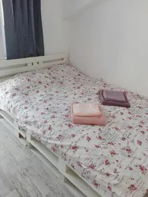 a bed with two towels on it in a room at INFINITY Blue 1 in Burgas City