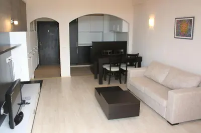 a living room with a couch and a table at Aparthotel VRIS in Tsarevo