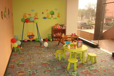 a childs play area with a table and stools at Aparthotel VRIS in Tsarevo