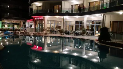 a hotel with a swimming pool in front of a building at Blue Bay Hotel in Sunny Beach