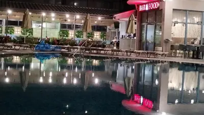 a swimming pool in front of a hotel at Blue Bay Hotel in Sunny Beach