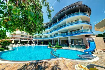 a hotel with a swimming pool in front of a building at Blue Bay Hotel in Sunny Beach