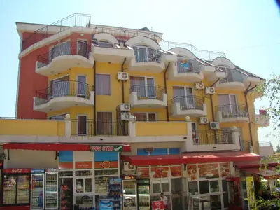 a yellow building with balconies on the side of it at Hotel Bellisimo in Lozenets