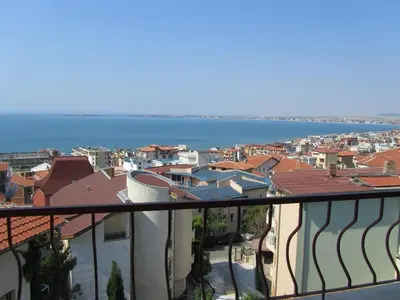 a view of a city and the ocean from a balcony at House Sofia in Sveti Vlas